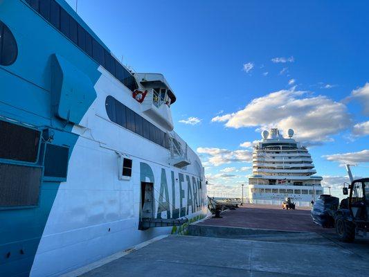 Balearia ferry at the dock adjacent to a cruise ship