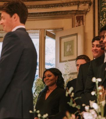 Officiant in awe as the bride is sharing her personally written vows to her husband.