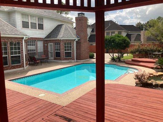 Residential hardscape service: Brush scrubbed brick entry, sidewalks, driveway, curbs & street gutter, patio and pool deck.