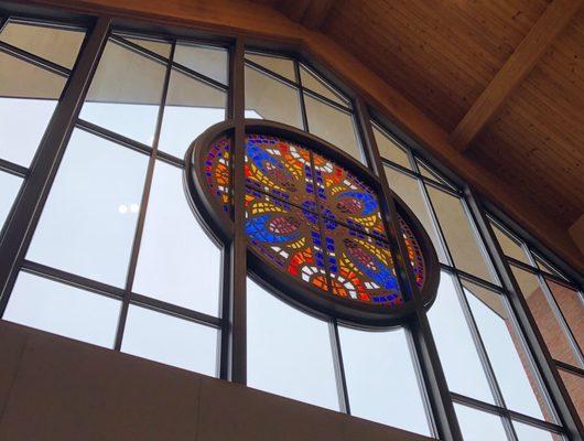 Frontal stained glass window from inside the lobby