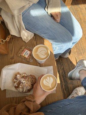 Oat latte, gluten free granola bar, almond croissant, flat white