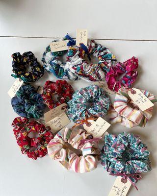 Made by CTM scrunchies - designed by Common Threads Staff, sewn by textile work training students, using donated materials