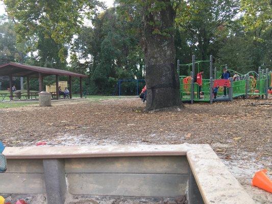 View from the sand box - there is a large overhang area with tables