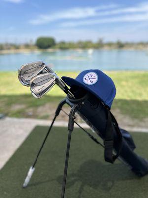 Golf clubs and hat