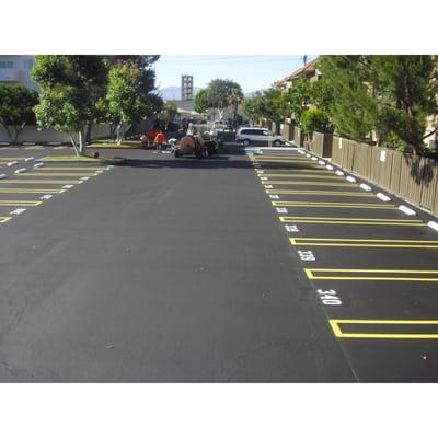 Parking Lot Seal Coat and Striping Parking Spaces