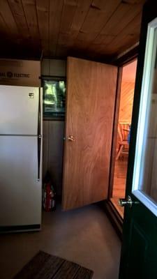 Blue Spruce - entry room extra fridge and door to d.r./kitchen