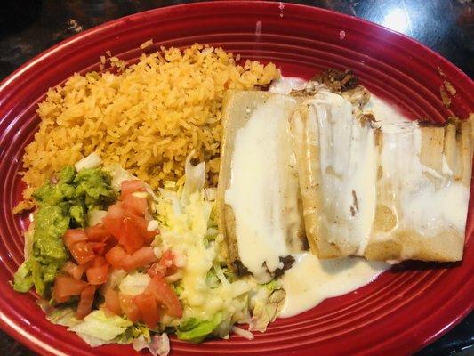 Hot Tamales Platter with rice and guacamole salad