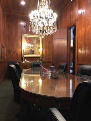 Our large closing room is 15' high, accommodates up to 12 people, and features Pecky Cypress walls, 12' Cypress doors, and antique decor.