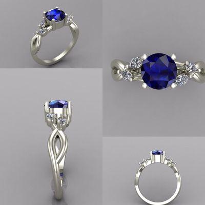 One carat round blue sapphire center with side accent round diamonds