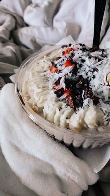 Cacao-nut Bowl with light strawberries, shredded coconut, peanut butter base, chia seeds, and extra banana!