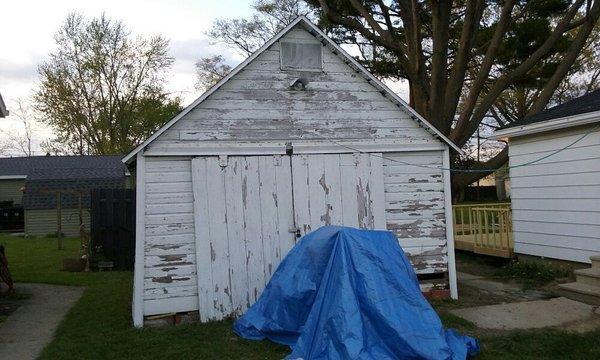 Old garage before new siding and new roof.