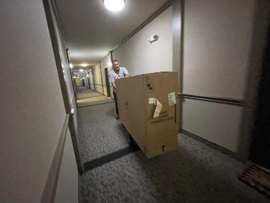 Dresser being delivered to frequent customer's apartment