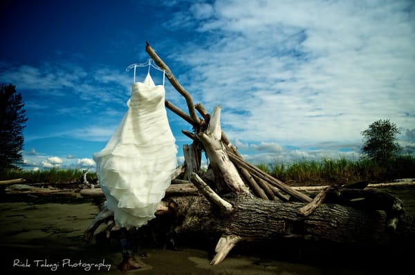 The driftwood on the beach makes for a perfect background when shooting wedding photos on the island.