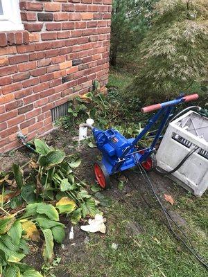 Opening a main drain from a clean out.