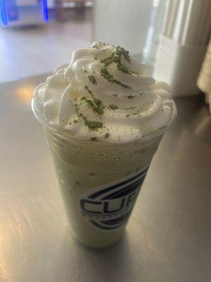 Matcha Spice Latte topped with Whipped Cream and Matcha Powder