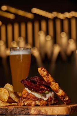 Chicken and Waffle crispy chicken, pickle, cherrywood smoked bacon, cheddar, maple mayo