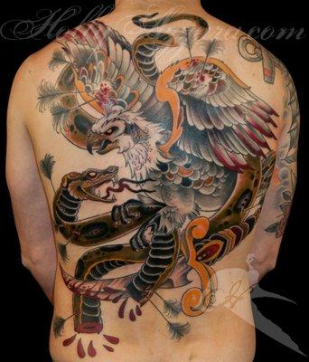 Tattoo by Holly Azzara
 eagle vs. snake traditional back piece