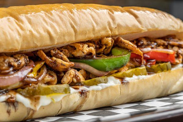 The Chicken Catcher:
 Marinated thin sliced chicken with special spices, garlic sauce, pickles, grilled onions.