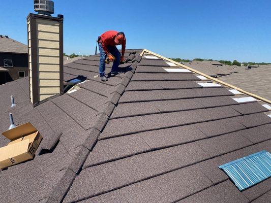 Hurricane Shake Steel being installed over existing 3-tab roof