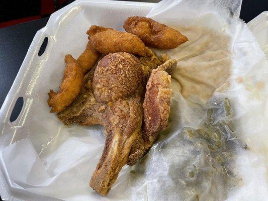 Fried pork chop, navy beans, green beans, and hushpuppies