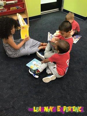 Our little learners reading some of their favorite books!