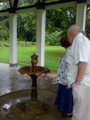 Some of my bus tour guests try water from the High Rock Spring in Saratoga Springs, NY