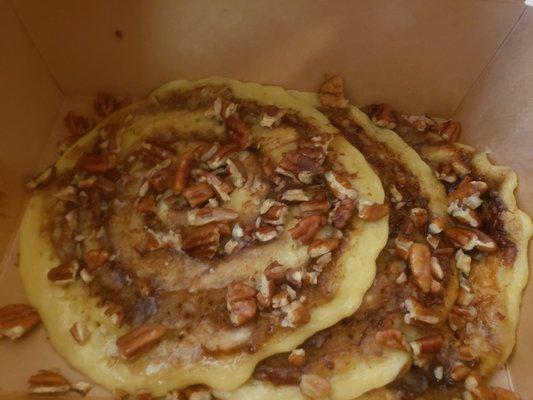 Cinnamon Roll Pancakes with toasted pecans and maple icing.