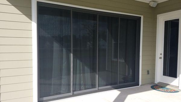 Manual wall screen for large openings as tall as 10' and as wide as 12'