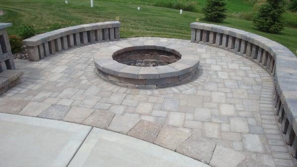 Custom firepit with additional seating that lets the breeze blow thru and allows the kids easy access to the yard.