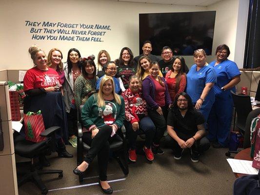 Happy crew! Fun Holiday ugly sweater at the office!