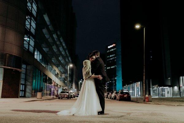 Bride & Groom hug in downtown Toledo during their NYE wedding!