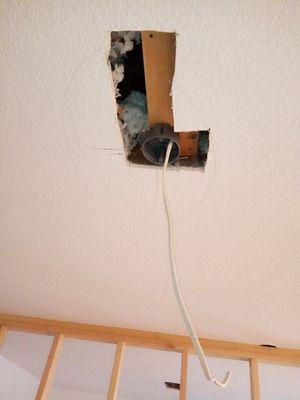 Ceiling fan pulling wires.