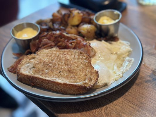 Breakfast with perfectly cooked pancetta and extra hollandaise sauce.