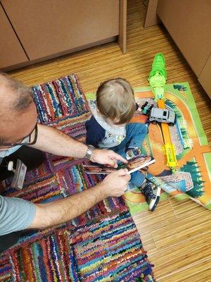 mark showing my son a book with kids wearing glasses