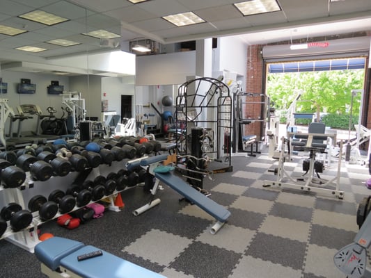 California Style gym with open doors and skylights