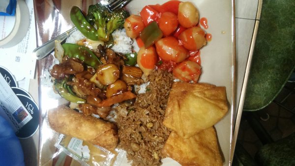 Sezchwan beef, pork fried rice, crab rangoon, egg roll and sweet and sour chicken