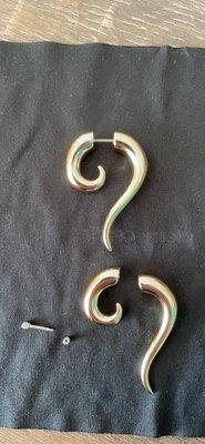 top: what the earring is supposed to look like.   bottom: jewelry pieces with the bar detached