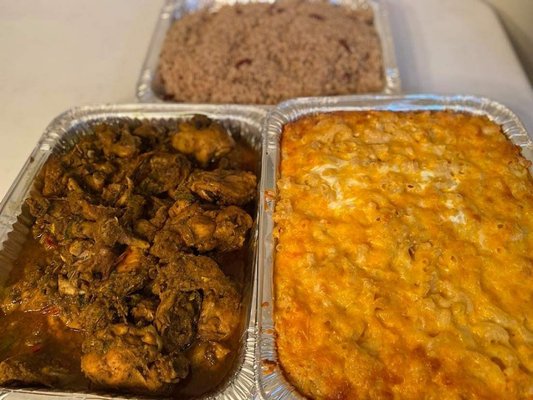 Pans of curry chicken, rice and peas and 6 cheese baked mac & cheese