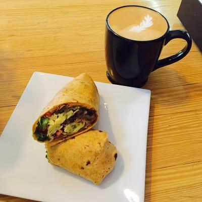 Rise & Shine breakfast burrito with a signature latte design.