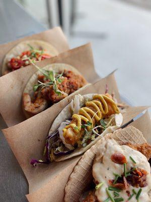 Fish tacos, shrimp and grits, chicken and waffles taco