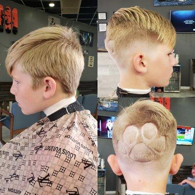 Mid Bald Fade with Scissor Work and Creative Tiger Paw Design.