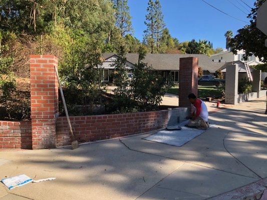 Built brick pillars up from 18" to 60" before fence installation - amazing work