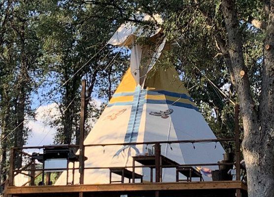 Giant Tipi with large deck 2 queen beds and claw foot bathtub