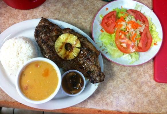 New York Strip with vegetable soup and a side of salad