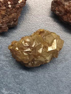 Yellow andradite garnet. I have purple specimens as well one of which has pyrite inclusions