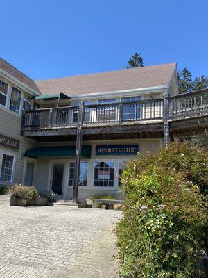 Upstairs next to Healing Arts day spa.