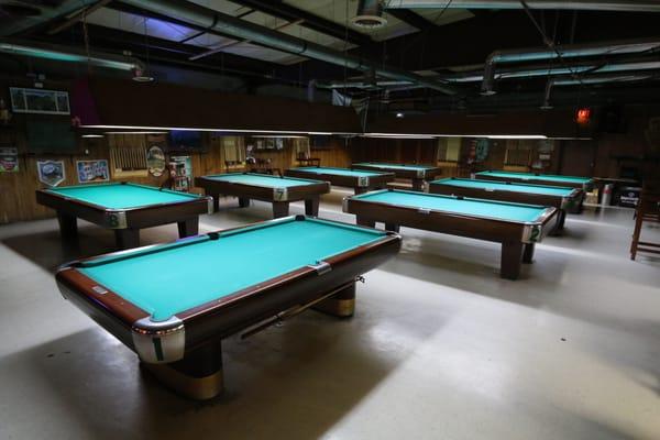 Eight Brunswick professional quality 9 ft. tables covered in super fast Simonis billiard fabric.