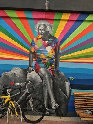 Mural by KOBRA of a laid back Albert Einstein dressed in the typical Palm Beach attire