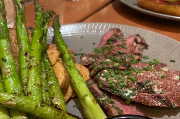 Flat iron steak and potatoes with asparagus