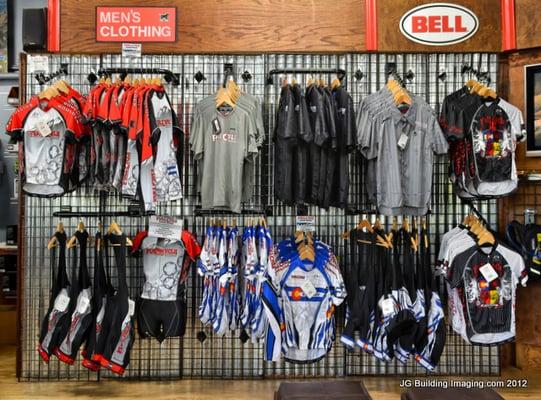 A wall of Full Cycle riding jerseys.